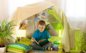 kid inside a reading tent