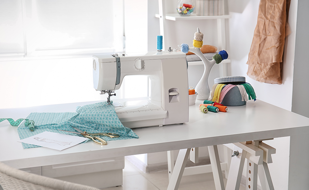 sewing room wigh white desk and sewing machine